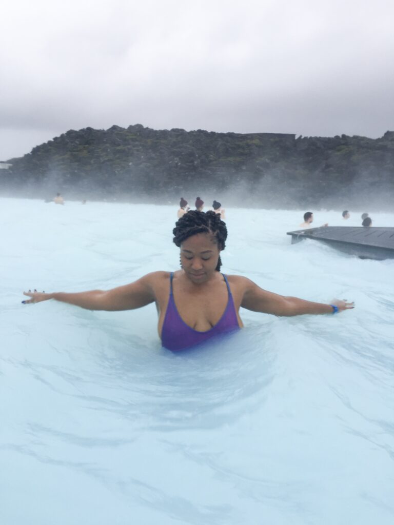 A woman in the water at the blue lagoon.